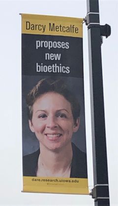 Picture of Darcy Metcalfe on a streetlight banner