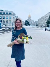 Dr. Emma Rifai stands outside the Old Capital Building