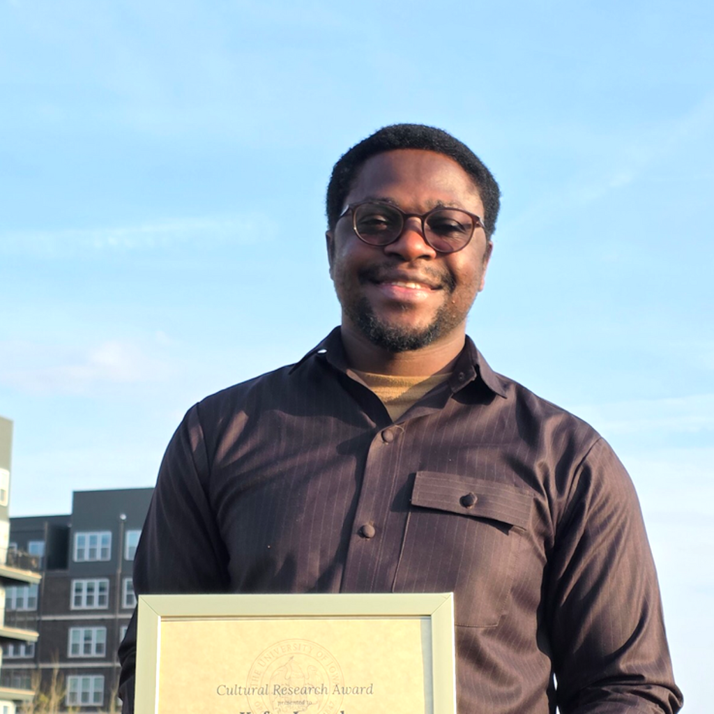 Kefas with his award certificate