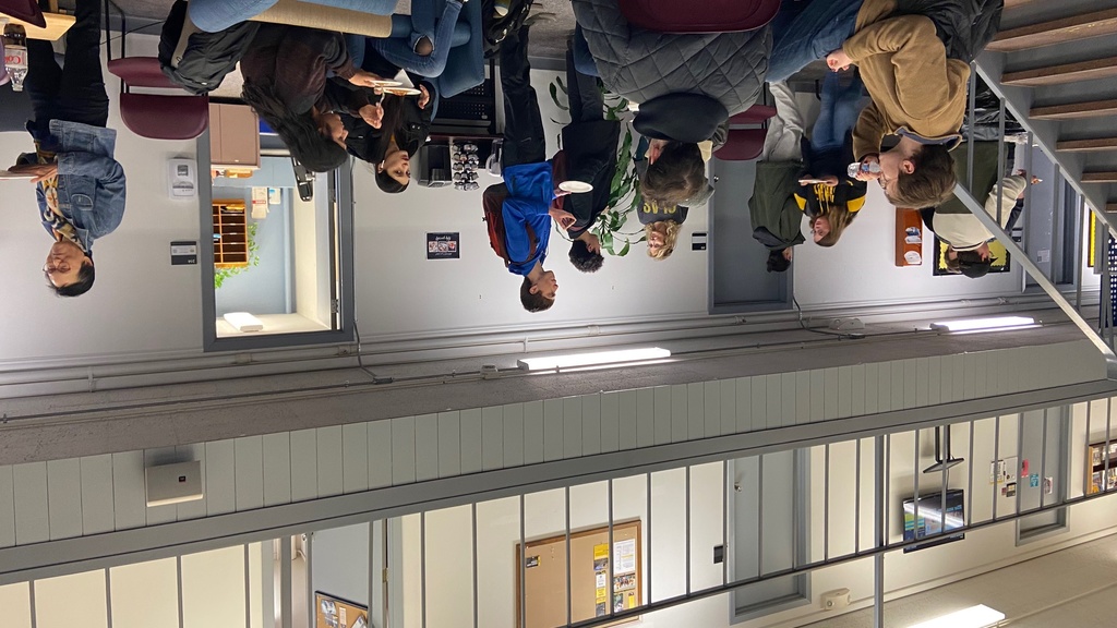 Students enjoying time together at a monthly social event